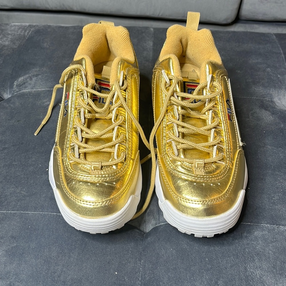 Metallic gold Filas with white trim